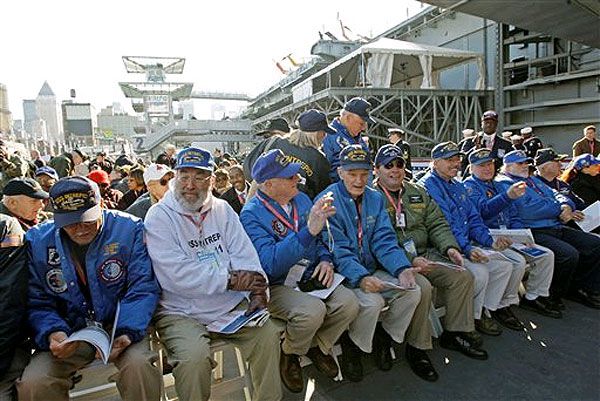 Former USS Intrepid crewmembers await President Bush and First Lady Bush.P